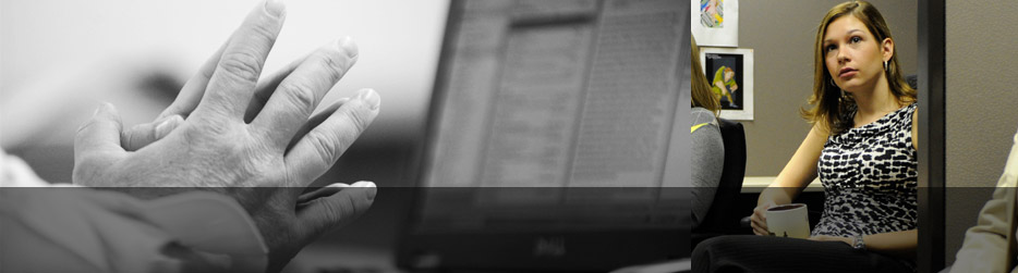 black and white landscape picture of folded hands with a PC screen in the background next to an image of a recruiter from Talascend during a morning board meeting. While most engineering staffing agencies use stock photography we choose to put our employees front and center because personal relationships are key in our industry.