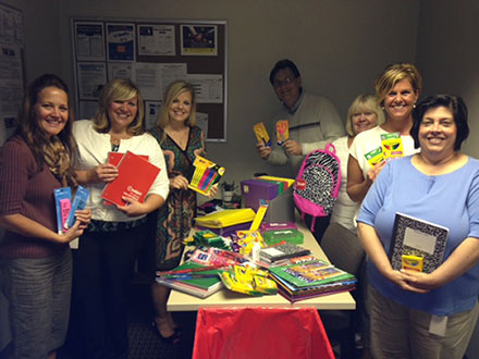 Talascend Troy, Michigan Recruiting Professionals line to up to display their back-to-school contribution for metro Detroit children.  