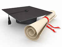 graduation cap and rolled up diploma with ribbon